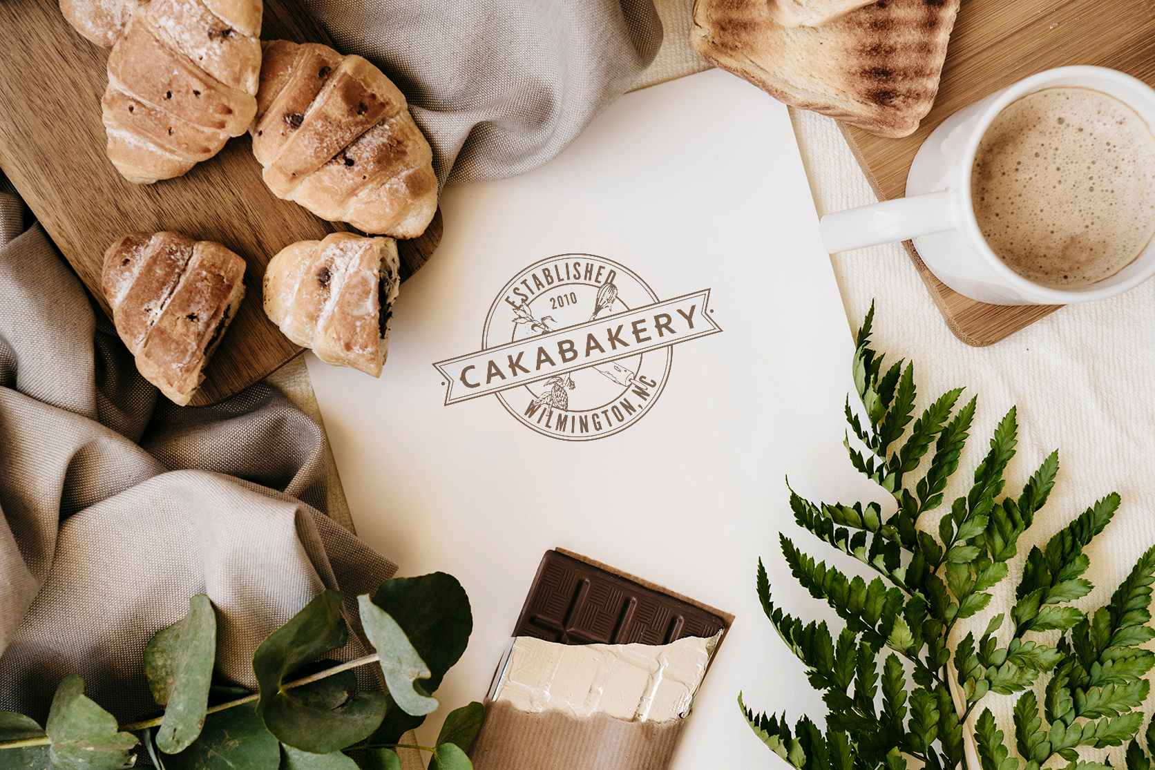 Cakabakery logo on paper on table