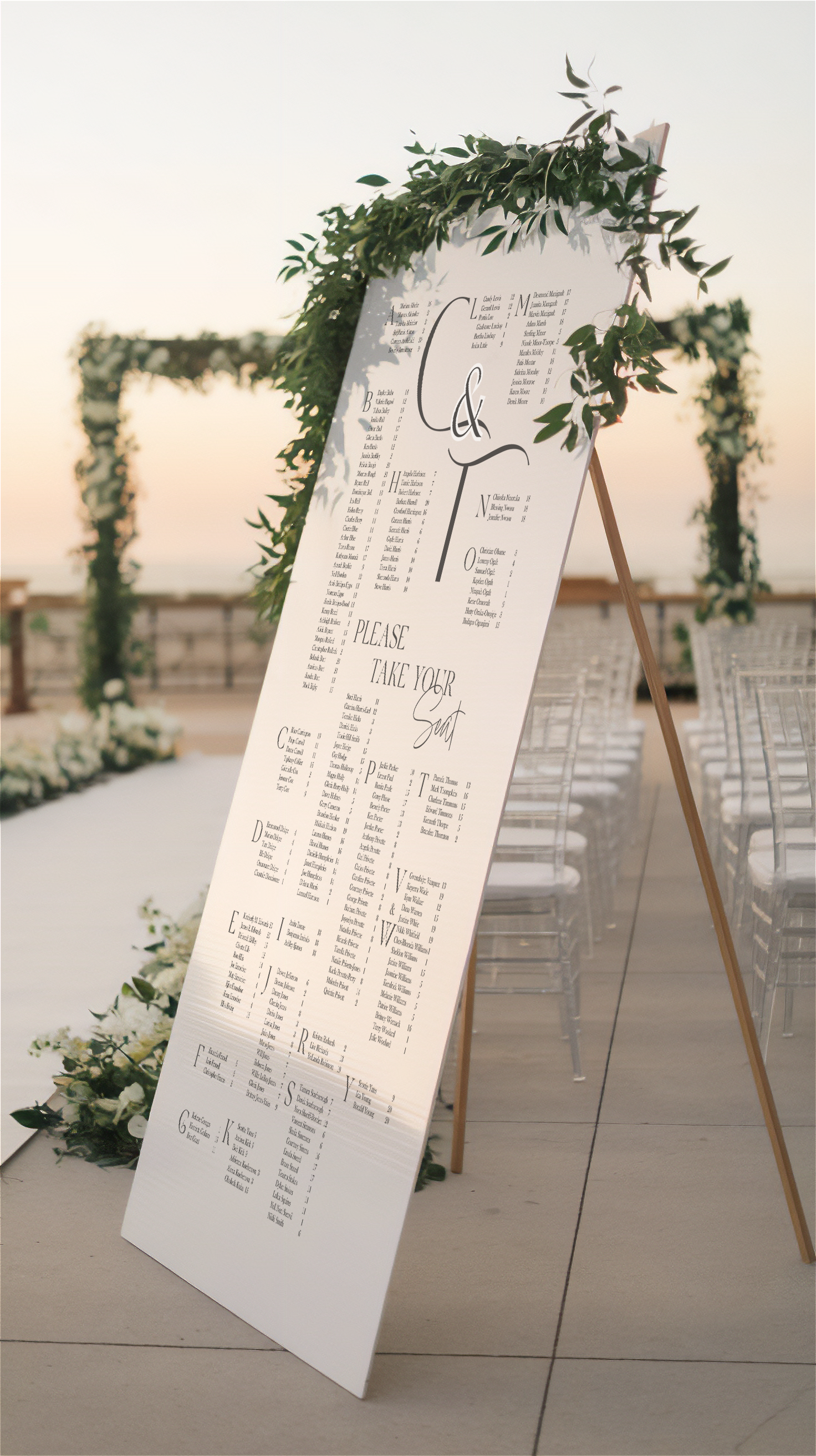 Wedding seating chart outside at processional